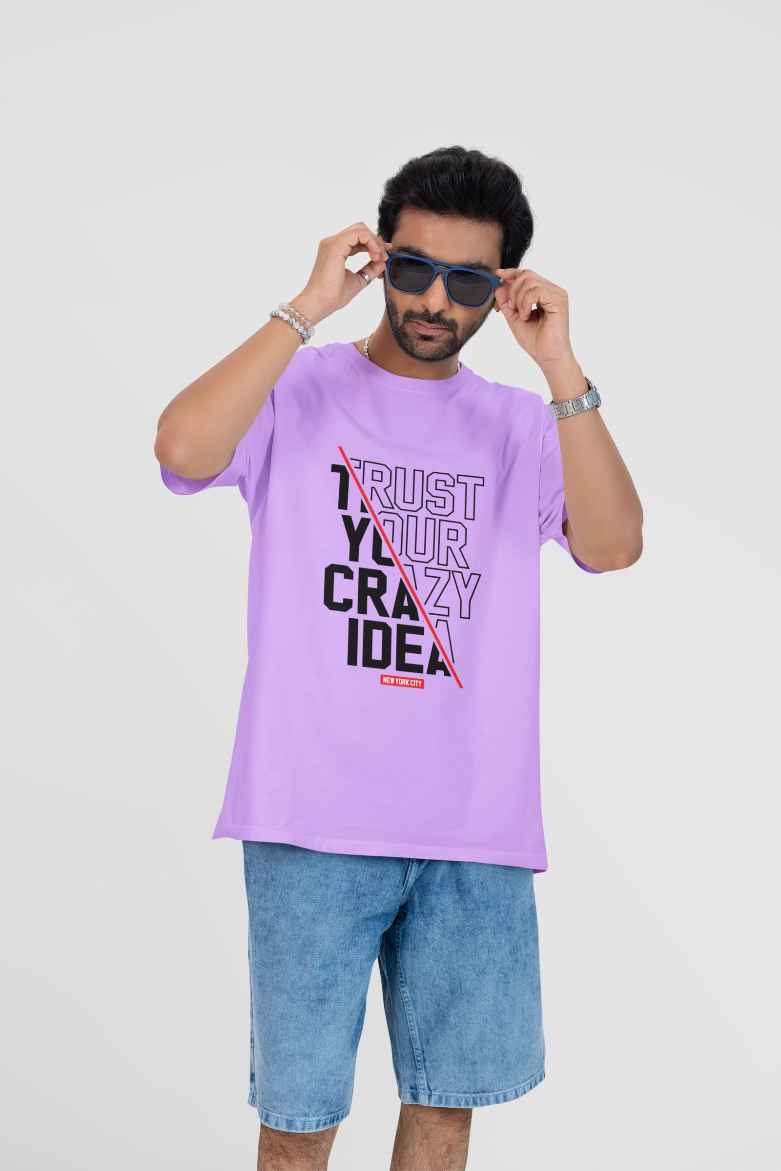 Pastel lavender oversized T-shirt with bold "Crazy Idea" print on the front, perfect for streetwear lovers.

