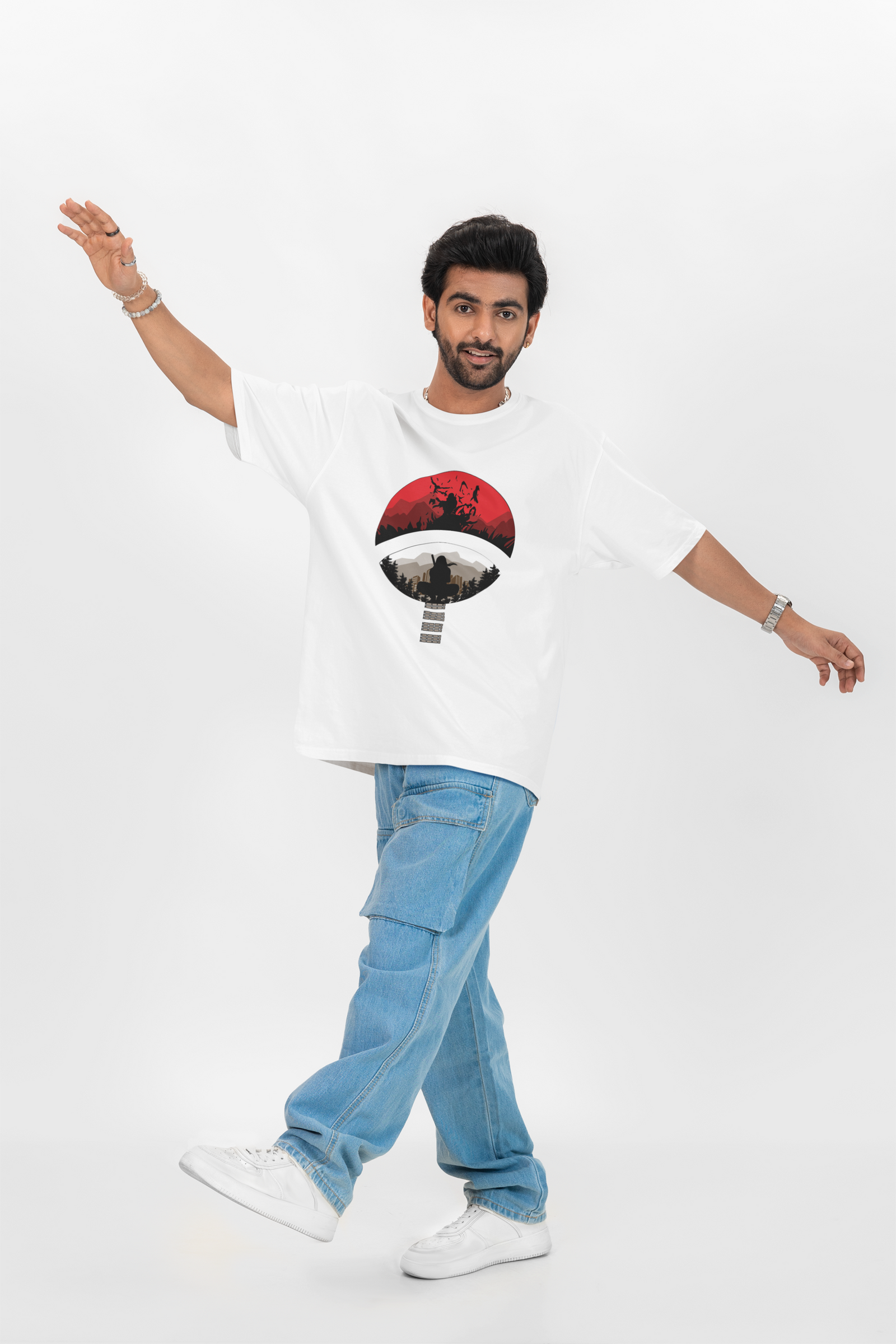 Model wearing Urbaxo’s Itachi Oversized T-shirt, front-facing with striking Itachi artwork.