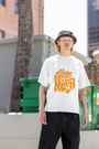 White oversized t-shirt featuring "Future Is Nasty" design, perfect for bold, fashion-forward streetwear