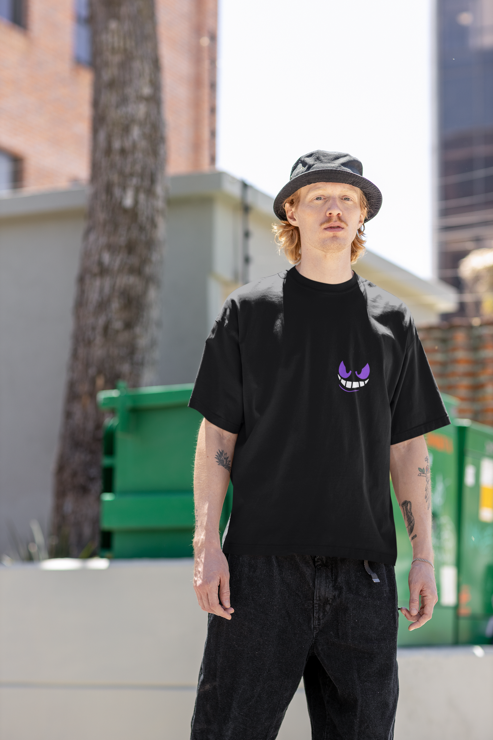 Urbaxo's oversized T-shirt featuring a detailed monster graphic on the front and back, crafted for an edgy, relaxed streetwear vibe