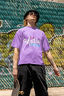 Lavender Adventure T-shirt by Urbaxo laid flat, displaying front design and relaxed fit.