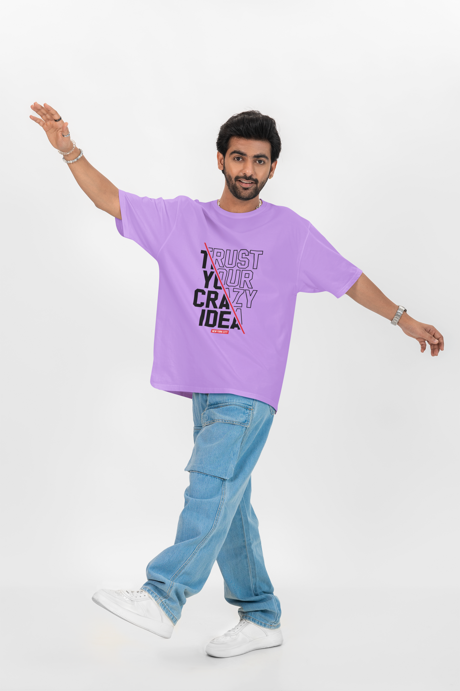 Lavender oversized T-shirt with front "Crazy Idea" text, combining soft tones with a confident message.

