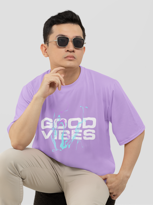 Oversized lavender T-shirt with "Good Vibes" front text, radiating positivity and relaxed streetwear style.
